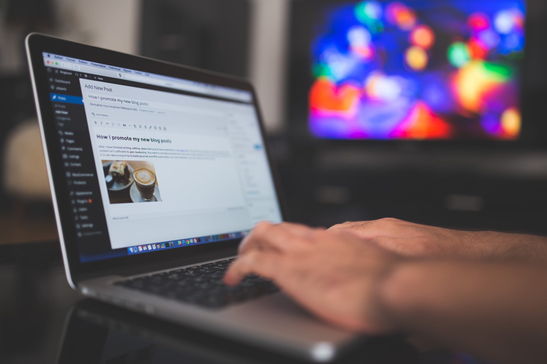 person holding turned on silver laptop computer